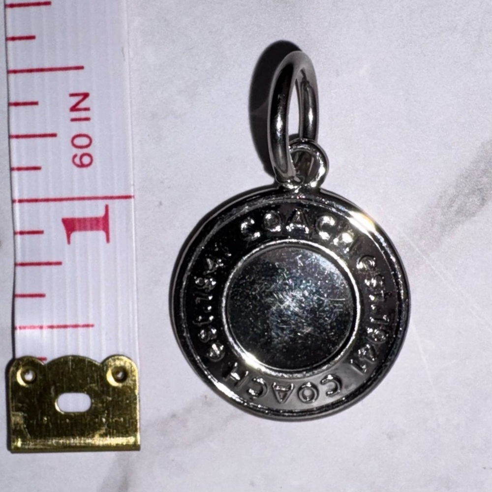Coach Shiny Silver Round Logo Charm Pendant Hangtag 1” diameter stamped Coach